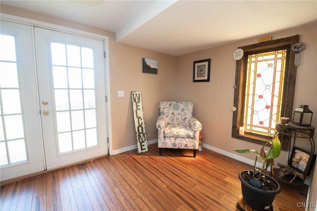 1109 Church Rd, Lysander, NY 13027 - sitting room featuring healthy amount of natural light, wood finished floors, and french doors