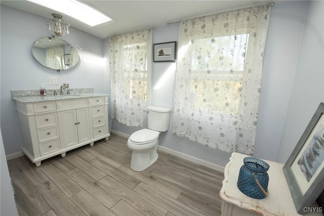 1109 Church Rd, Lysander, NY 13027 - full bathroom with vanity and wood finished floors