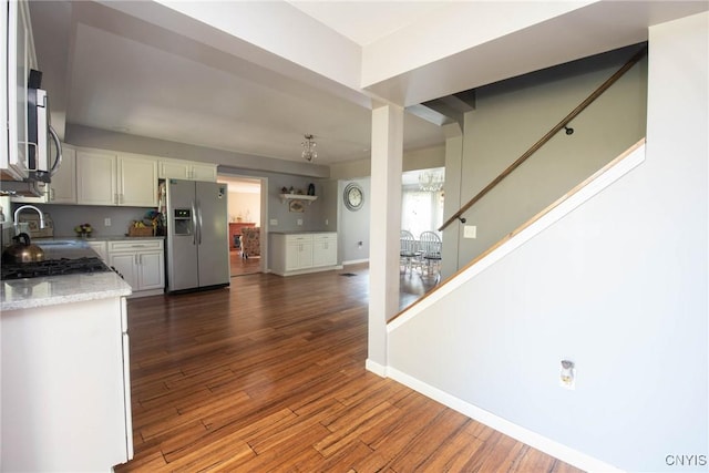 1109 Church Rd, Lysander, NY 13027 - kitchen with appliances with stainless steel finishes, white cabinetry, and dark wood-type flooring