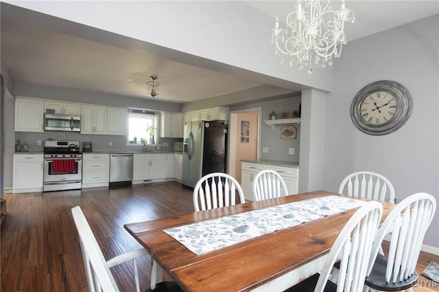 1109 Church Rd, Lysander, NY 13027 - dining area with dark wood-style floors and a chandelier