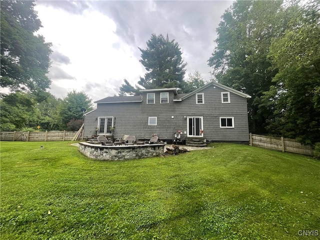 1109 Church Rd, Lysander, NY 13027 - rear view of house featuring a fenced backyard, a patio, entry steps, and french doors