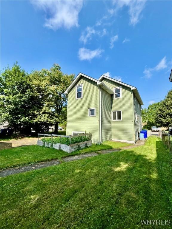 39 Klas Ave, West Seneca, NY 14224 - rear view of house with a vegetable garden