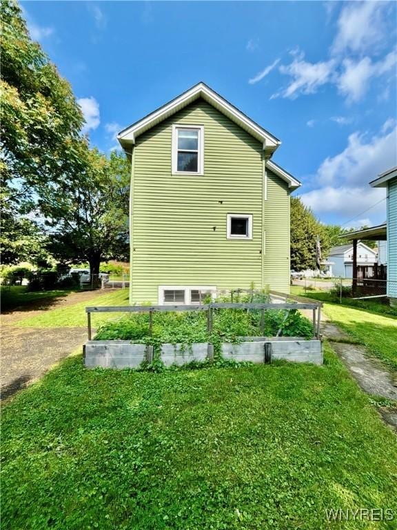 39 Klas Ave, West Seneca, NY 14224 - view of side of property featuring a garden and a lawn