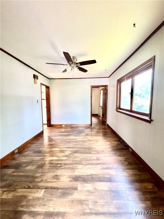 39 Klas Ave, West Seneca, NY 14224 - empty room featuring wood finished floors, ornamental molding, and a ceiling fan
