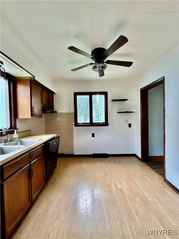 39 Klas Ave, West Seneca, NY 14224 - kitchen with dishwasher, ceiling fan, light wood-style floors, under cabinet range hood, and light countertops