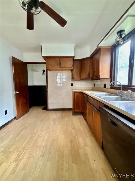 39 Klas Ave, West Seneca, NY 14224 - kitchen with dishwashing machine, light wood-style flooring, a ceiling fan, and light countertops