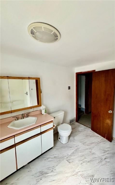 39 Klas Ave, West Seneca, NY 14224 - bathroom featuring marble look tiles and vanity