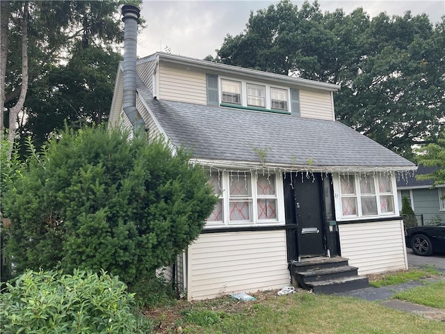 37 Outlook Dr, Irondequoit, NY 14622 - split level home featuring entry steps, a shingled roof, and a chimney
