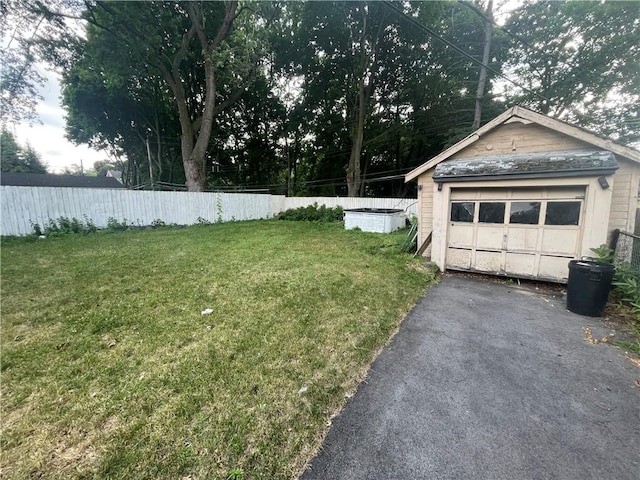37 Outlook Dr, Irondequoit, NY 14622 - view of yard featuring an outbuilding, a detached garage, and driveway