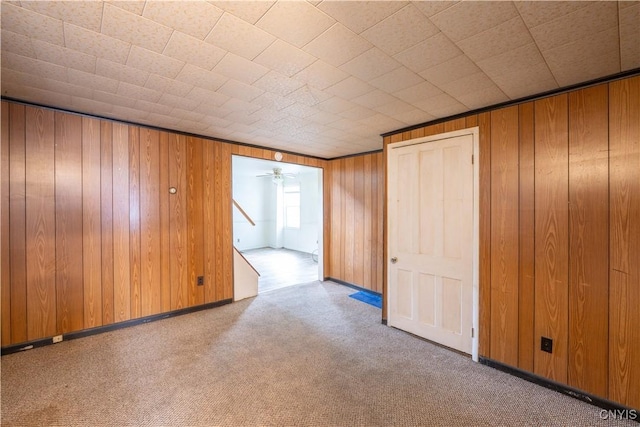 103 Stanwix St, Rome, NY 13440 - carpeted spare room featuring wood walls