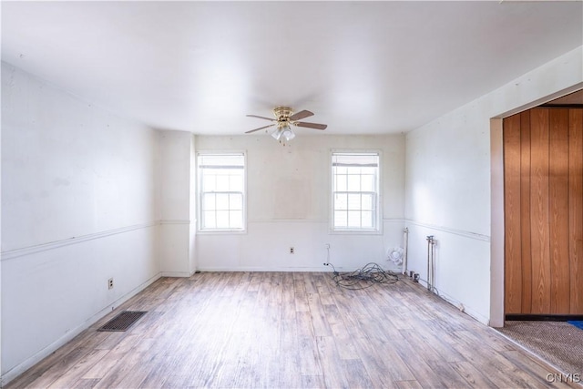 103 Stanwix St, Rome, NY 13440 - empty room with light wood-style floors and a ceiling fan