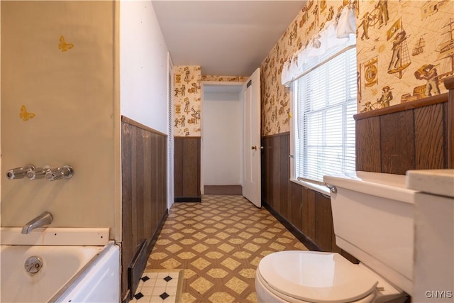 103 Stanwix St, Rome, NY 13440 - full bathroom featuring wallpapered walls, wainscoting, tile patterned floors, and wooden walls