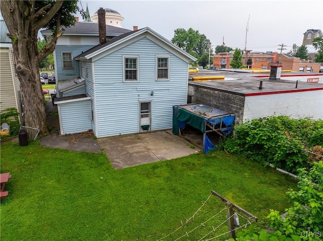 103 Stanwix St, Rome, NY 13440 - rear view of property with a patio area and a lawn