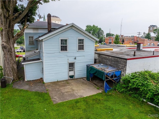 103 Stanwix St, Rome, NY 13440 - rear view of property with a lawn and a patio area