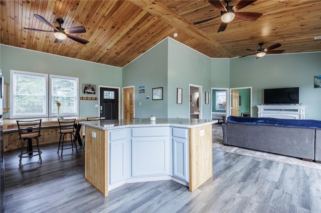 7156 County Line Rd, Naples, NY 14512 - kitchen with ceiling fan, light wood-style flooring, a kitchen island, a wooden ceiling with exposed beams, and high vaulted ceiling