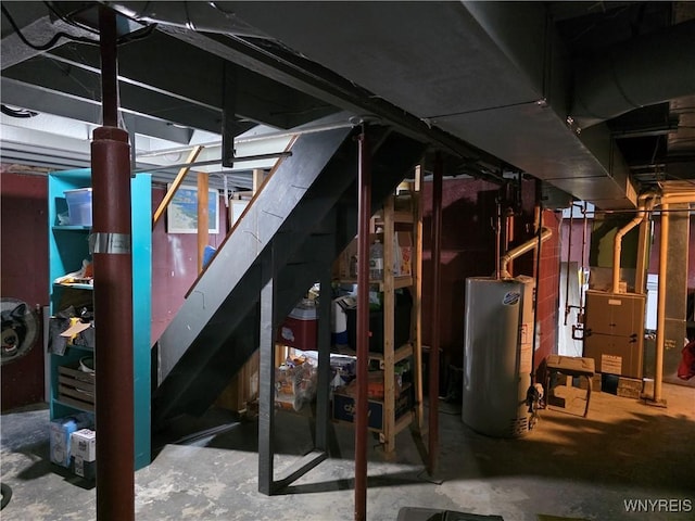 4049 River Rd, Lewiston, NY 14174 - unfinished basement with gas water heater, stairs, and heating unit