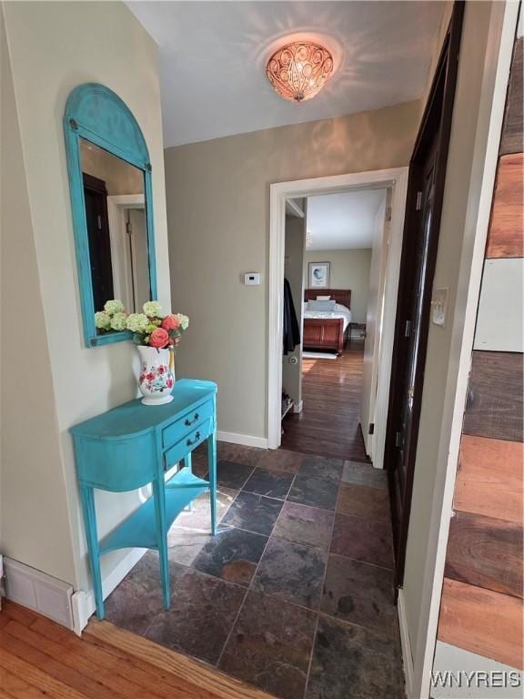 4049 River Rd, Lewiston, NY 14174 - corridor with baseboards and stone finish flooring