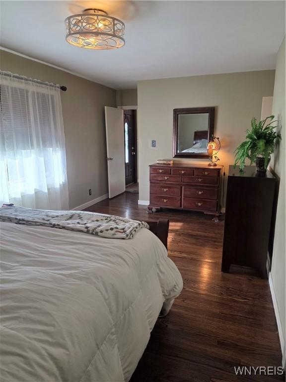 4049 River Rd, Lewiston, NY 14174 - bedroom featuring dark wood-type flooring and baseboards