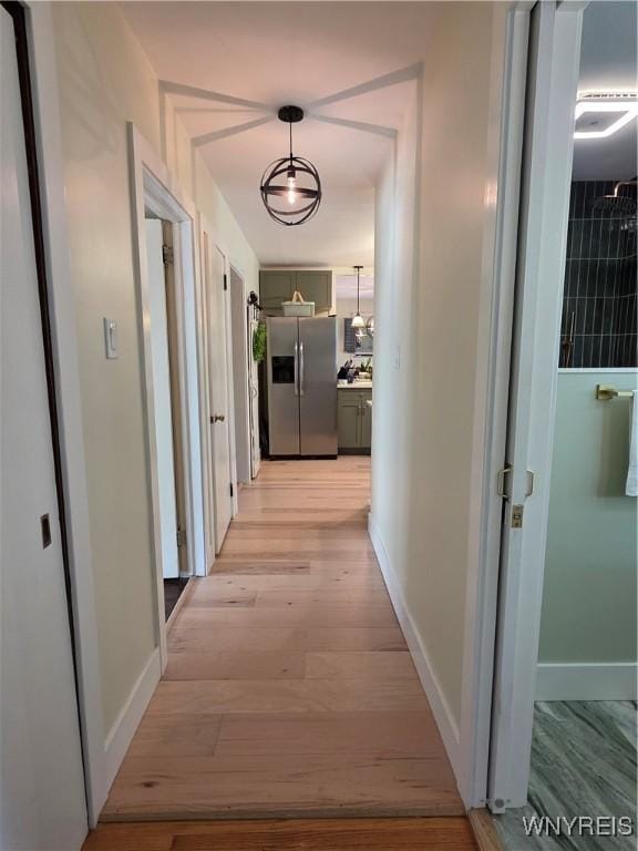 4049 River Rd, Lewiston, NY 14174 - hall with baseboards and light wood-type flooring