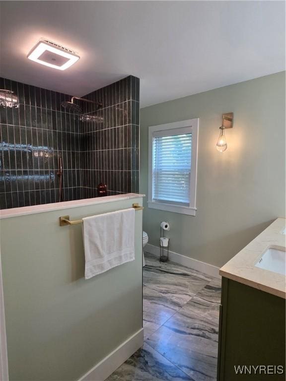 4049 River Rd, Lewiston, NY 14174 - bathroom with marble look tile flooring, vanity, and a tile shower