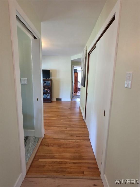 4049 River Rd, Lewiston, NY 14174 - hallway with light wood finished floors