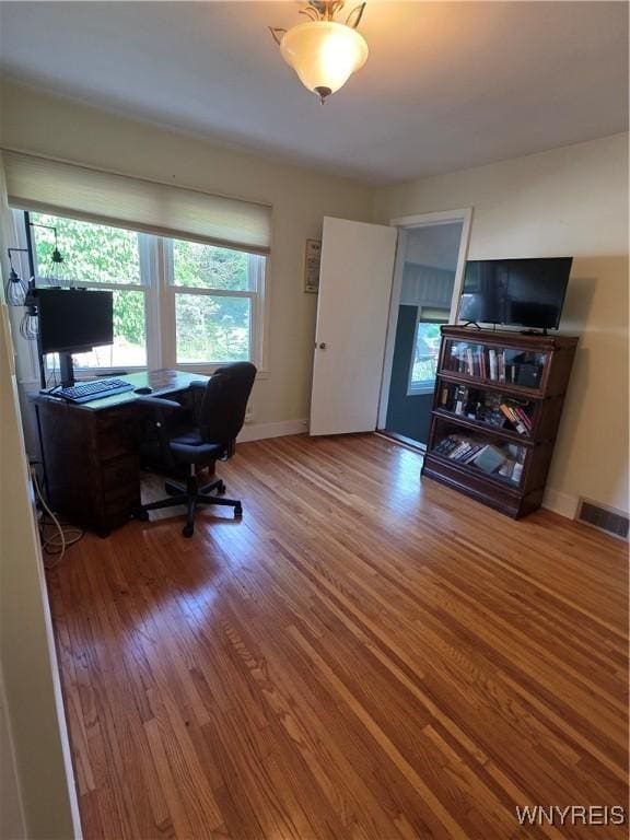 4049 River Rd, Lewiston, NY 14174 - home office featuring wood finished floors and baseboards