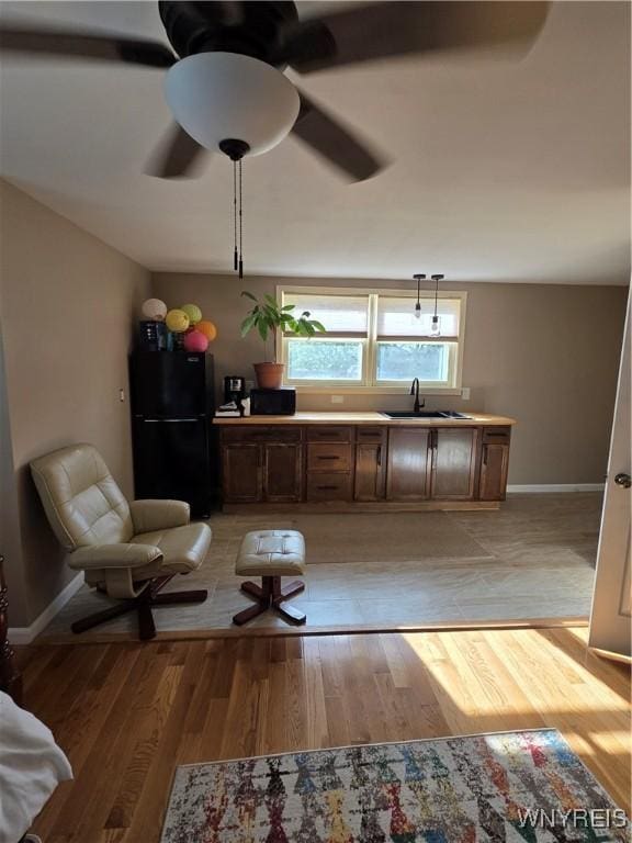 4049 River Rd, Lewiston, NY 14174 - sitting room featuring ceiling fan and light wood finished floors