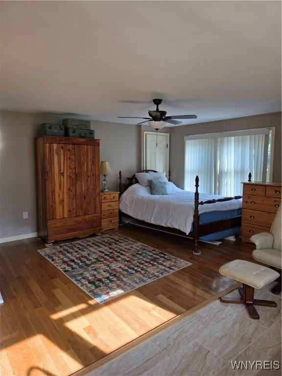 4049 River Rd, Lewiston, NY 14174 - bedroom with wood finished floors and a ceiling fan