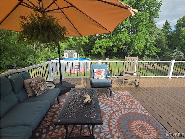 4049 River Rd, Lewiston, NY 14174 - deck with an outdoor living space, a storage unit, and view of scattered trees