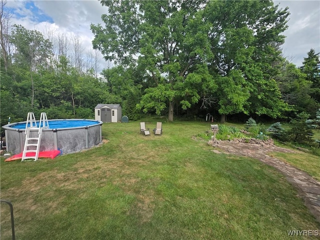 4049 River Rd, Lewiston, NY 14174 - view of grassy yard featuring a storage unit and an outdoor pool