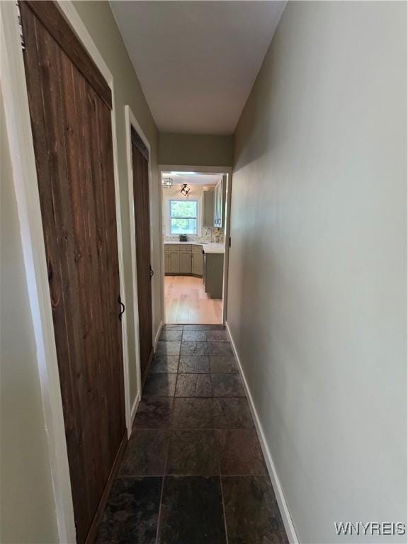 4049 River Rd, Lewiston, NY 14174 - hall with stone tile flooring and baseboards