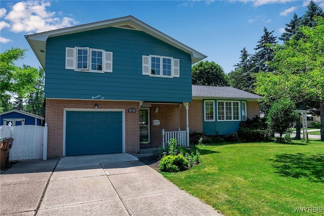 17 Frantzen Ter, Cheektowaga, NY 14227 - tri-level home with brick siding, a garage, covered porch, and driveway
