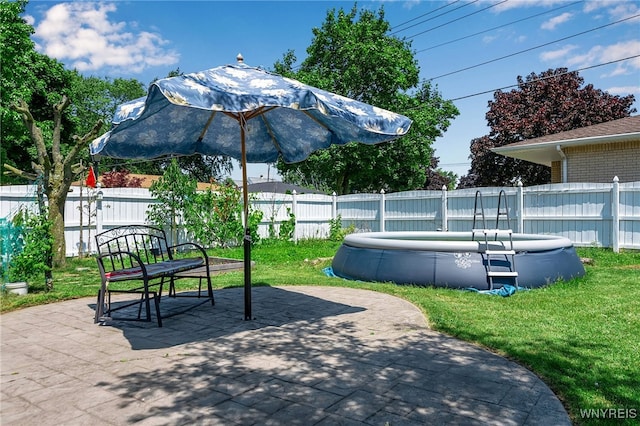 17 Frantzen Ter, Cheektowaga, NY 14227 - view of property's community featuring a fenced backyard, a pool, and a patio