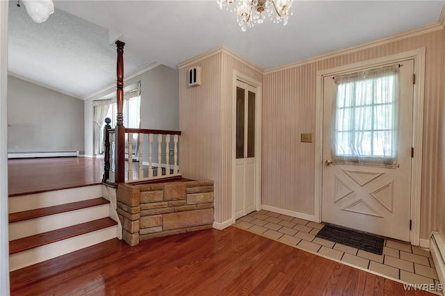 17 Frantzen Ter, Cheektowaga, NY 14227 - entrance foyer featuring a baseboard heating unit, crown molding, wood finished floors, a chandelier, and plenty of natural light