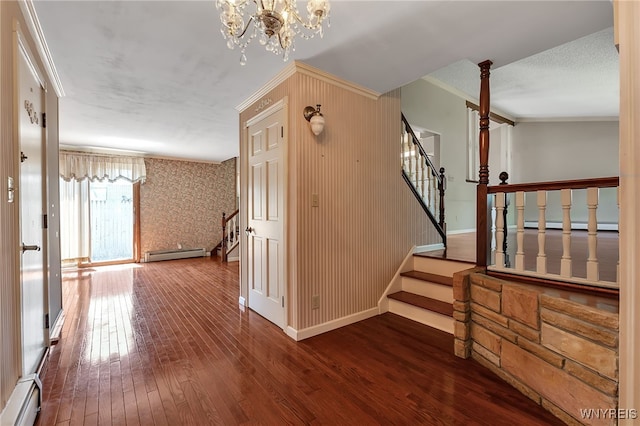 17 Frantzen Ter, Cheektowaga, NY 14227 - hallway with baseboard heating, stairs, crown molding, hardwood / wood-style floors, and a baseboard heating unit