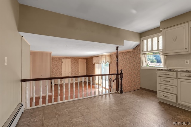 17 Frantzen Ter, Cheektowaga, NY 14227 - kitchen featuring baseboard heating, wallpapered walls, white cabinetry, and light countertops