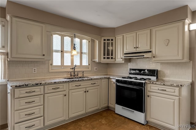 17 Frantzen Ter, Cheektowaga, NY 14227 - kitchen featuring gas range, under cabinet range hood, light stone counters, and white cabinetry