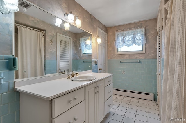 17 Frantzen Ter, Cheektowaga, NY 14227 - full bathroom featuring a baseboard radiator, wallpapered walls, tile walls, vanity, and wainscoting