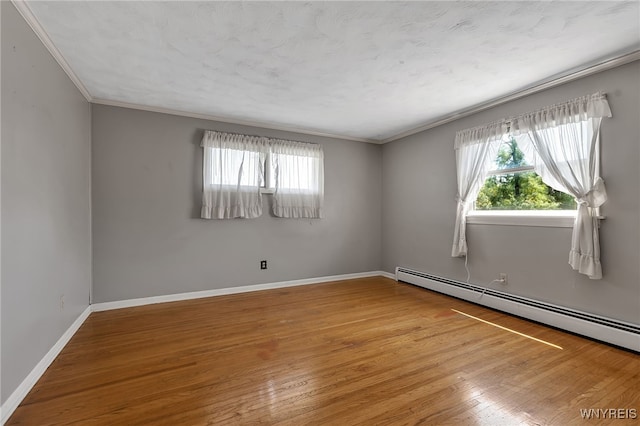 17 Frantzen Ter, Cheektowaga, NY 14227 - unfurnished room featuring baseboard heating, crown molding, and wood finished floors
