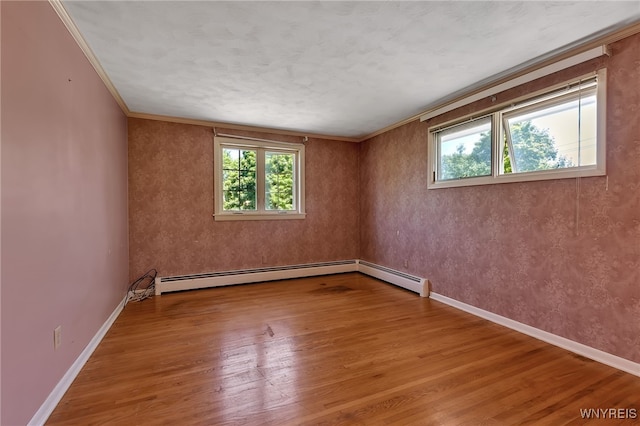 17 Frantzen Ter, Cheektowaga, NY 14227 - empty room with plenty of natural light, wood finished floors, a baseboard heating unit, and crown molding