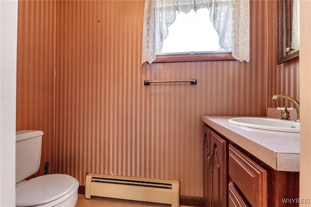 17 Frantzen Ter, Cheektowaga, NY 14227 - half bath with a baseboard radiator, vanity, and tile patterned floors