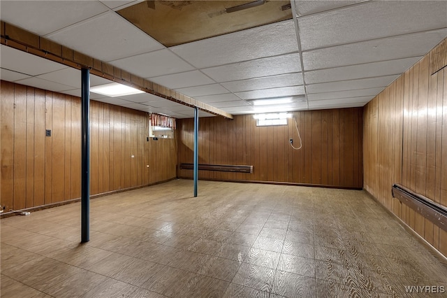 17 Frantzen Ter, Cheektowaga, NY 14227 - below grade area with a paneled ceiling, wood walls, and tile patterned floors