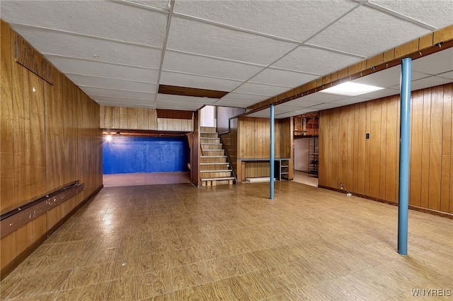 17 Frantzen Ter, Cheektowaga, NY 14227 - finished basement featuring stairs, a paneled ceiling, wood walls, and tile patterned floors