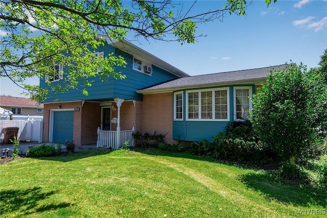 17 Frantzen Ter, Cheektowaga, NY 14227 - view of front of house with covered porch, brick siding, an attached garage, and driveway