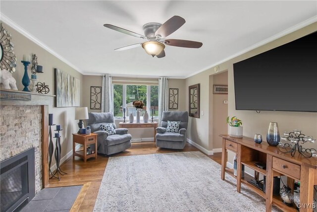 4956 Crestwood Ln, Onondaga, NY 13215 - living area with a fireplace, a ceiling fan, crown molding, and wood finished floors