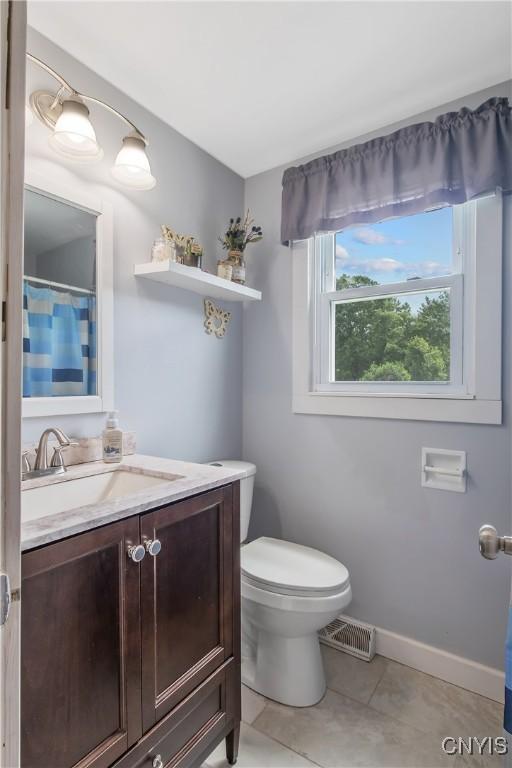 4956 Crestwood Ln, Onondaga, NY 13215 - full bathroom with tile patterned floors, vanity, and a shower with shower curtain