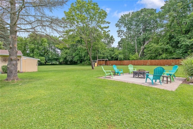 4956 Crestwood Ln, Onondaga, NY 13215 - view of yard featuring an outdoor fire pit, a patio, and view of wooded area