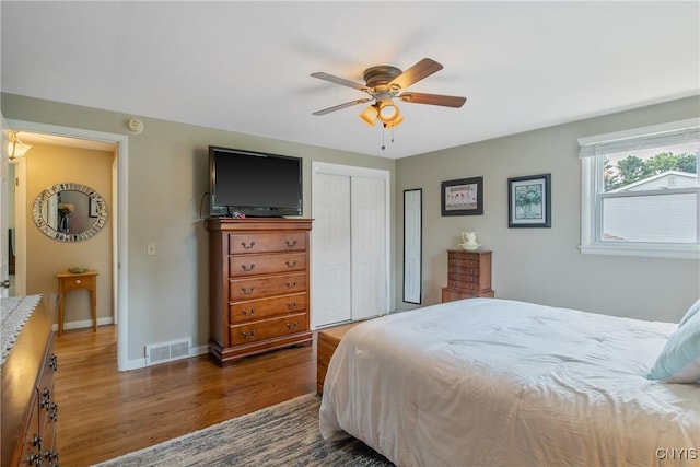 4956 Crestwood Ln, Onondaga, NY 13215 - bedroom with wood finished floors, a closet, and ceiling fan