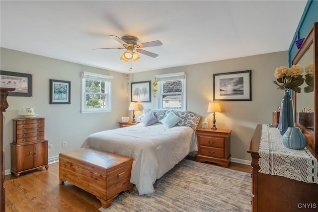 4956 Crestwood Ln, Onondaga, NY 13215 - bedroom with wood finished floors and ceiling fan