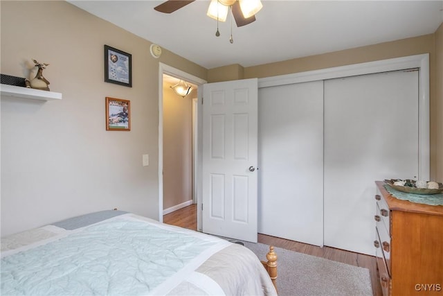 4956 Crestwood Ln, Onondaga, NY 13215 - bedroom with wood finished floors, a ceiling fan, and a closet